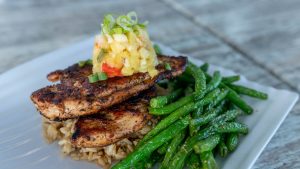 jerk chicken entree with pineapple pico de gallo and greenbeans